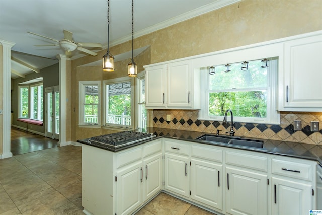 2940 Coatbridge Ln, Birmingham, AL 35242 - kitchen featuring a sink, dark countertops, tasteful backsplash, stainless steel gas stovetop, and crown molding