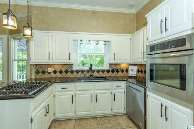 2940 Coatbridge Ln, Birmingham, AL 35242 - kitchen featuring appliances with stainless steel finishes, a sink, dark countertops, backsplash, and ornamental molding