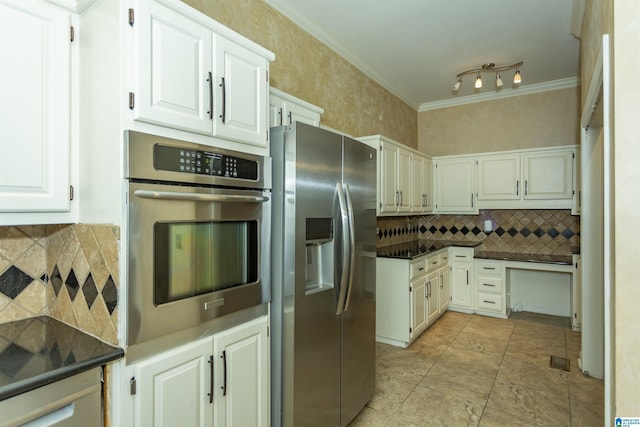 2940 Coatbridge Ln, Birmingham, AL 35242 - kitchen featuring stainless steel appliances, dark countertops, decorative backsplash, ornamental molding, and white cabinetry