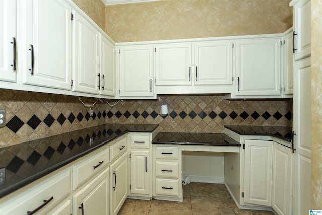 2940 Coatbridge Ln, Birmingham, AL 35242 - kitchen featuring dark countertops, light tile patterned floors, tasteful backsplash, and white cabinetry