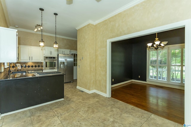 2940 Coatbridge Ln, Birmingham, AL 35242 - kitchen with stainless steel appliances, a sink, crown molding, a chandelier, and white cabinetry