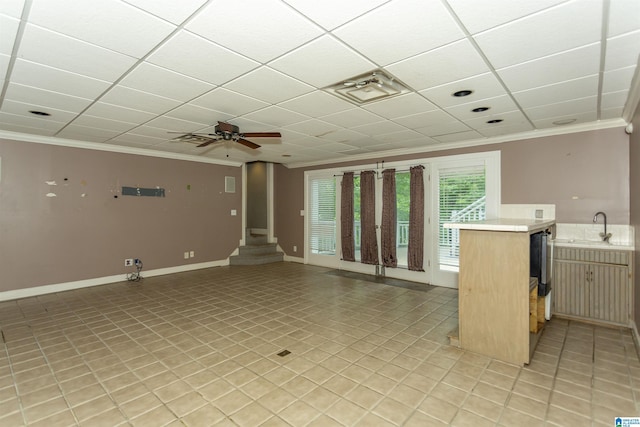2940 Coatbridge Ln, Birmingham, AL 35242 - unfurnished living room featuring crown molding, a sink, ceiling fan, a drop ceiling, and baseboards