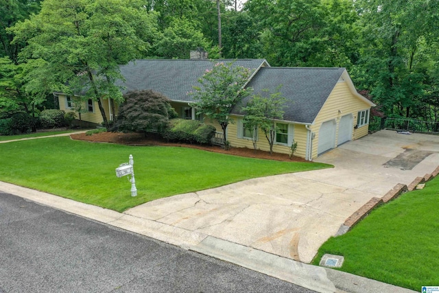 2940 Coatbridge Ln, Birmingham, AL 35242 - view of front facade with driveway, an attached garage, a chimney, and a shingled roof