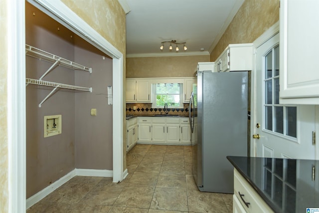 2940 Coatbridge Ln, Birmingham, AL 35242 - kitchen featuring freestanding refrigerator, a sink, dark countertops, white cabinets, and ornamental molding