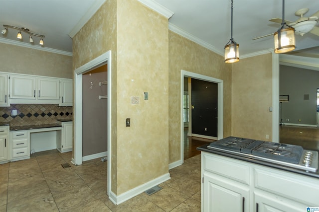 2940 Coatbridge Ln, Birmingham, AL 35242 - kitchen featuring dark countertops, ornamental molding, a ceiling fan, tasteful backsplash, and white cabinets