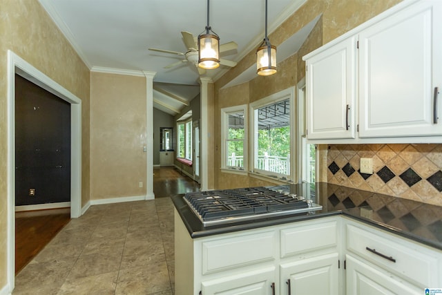 2940 Coatbridge Ln, Birmingham, AL 35242 - kitchen with decorative backsplash, dark countertops, ceiling fan, stainless steel gas cooktop, and lofted ceiling