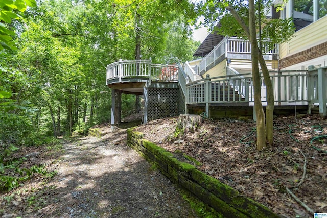 2940 Coatbridge Ln, Birmingham, AL 35242 - view of yard featuring a wooden deck and stairway