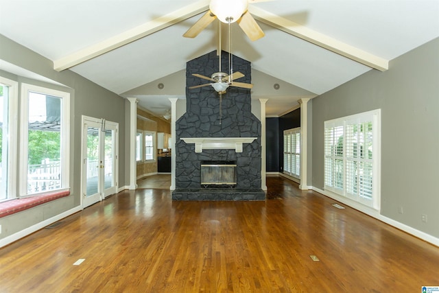 2940 Coatbridge Ln, Birmingham, AL 35242 - unfurnished living room featuring a ceiling fan, wood finished floors, baseboards, beamed ceiling, and a stone fireplace