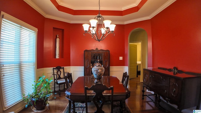 1035 Princeton Park, Montevallo, AL 35115 - dining space with arched walkways, a raised ceiling, wood finished floors, a chandelier, and ornamental molding