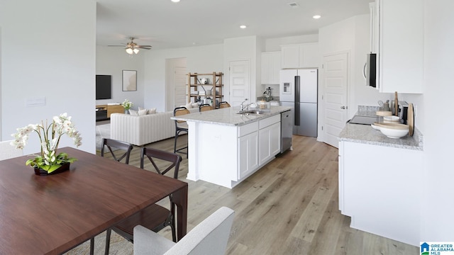 2008 Eaton Pl, Chelsea, AL 35043 - kitchen featuring stainless steel appliances, white cabinetry, light wood-style floors, a ceiling fan, and recessed lighting