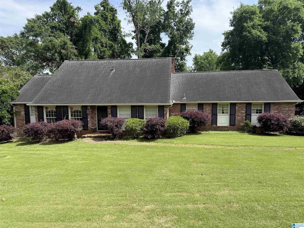 3593 Springhill Rd, Mountain Brook, AL 35223 - cape cod home featuring brick siding, a front yard, and roof with shingles
