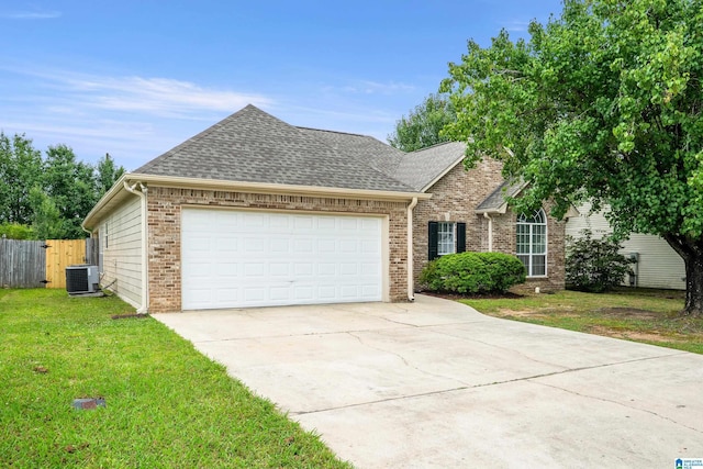 132 Summerchase Pkwy, Calera, AL 35040 - view of front of property featuring central AC, brick siding, an attached garage, concrete driveway, and a shingled roof