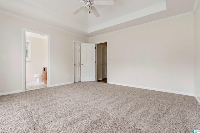 132 Summerchase Pkwy, Calera, AL 35040 - unfurnished bedroom with a tray ceiling, light carpet, ornamental molding, baseboards, and ensuite bathroom