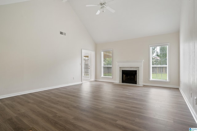 132 Summerchase Pkwy, Calera, AL 35040 - unfurnished living room with high vaulted ceiling, a fireplace, dark wood-style floors, a ceiling fan, and baseboards