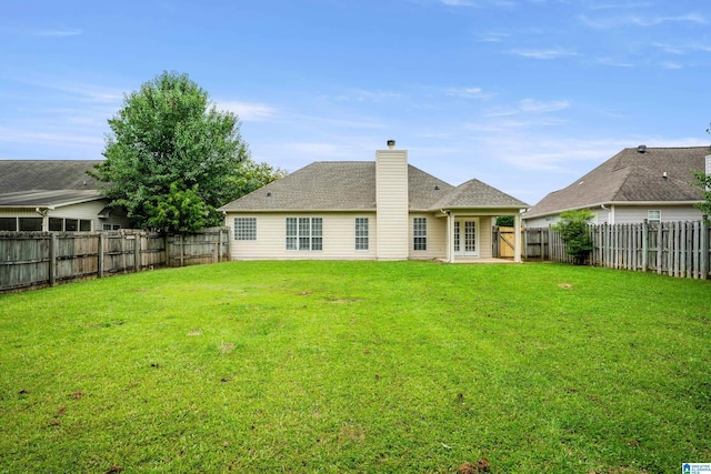 132 Summerchase Pkwy, Calera, AL 35040 - back of property featuring french doors and a chimney