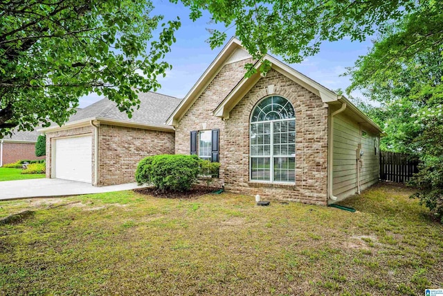 132 Summerchase Pkwy, Calera, AL 35040 - view of front of house featuring an attached garage, brick siding, concrete driveway, and roof with shingles