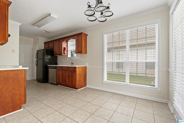 132 Summerchase Pkwy, Calera, AL 35040 - kitchen with freestanding refrigerator, light countertops, dishwasher, crown molding, and baseboards