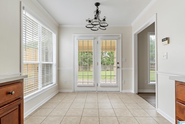 132 Summerchase Pkwy, Calera, AL 35040 - doorway to outside with a chandelier, crown molding, light tile patterned floors, and baseboards