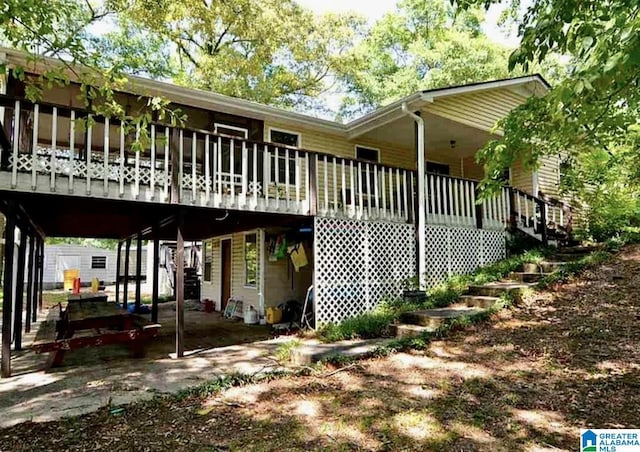 145 Maine Dr, Cropwell, AL 35054 - rear view of house with a carport and a wooden deck