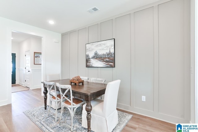 157 Shiloh Creek Dr, Calera, AL 35040 - dining room featuring a decorative wall, light wood finished floors, and recessed lighting