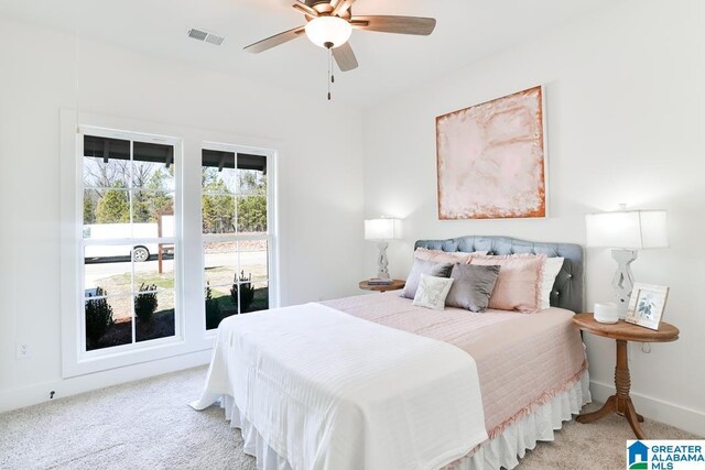157 Shiloh Creek Dr, Calera, AL 35040 - bedroom with light colored carpet, a ceiling fan, and baseboards