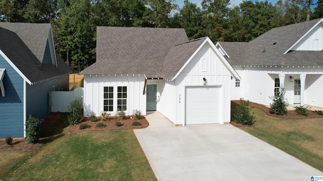 157 Shiloh Creek Dr, Calera, AL 35040 - modern farmhouse featuring board and batten siding, an attached garage, concrete driveway, and roof with shingles