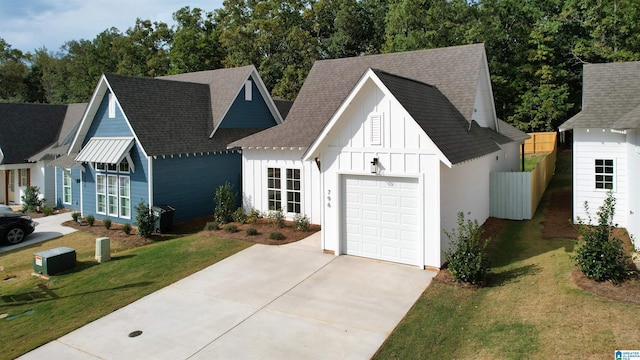 157 Shiloh Creek Dr, Calera, AL 35040 - modern farmhouse featuring driveway, a garage, board and batten siding, and a shingled roof