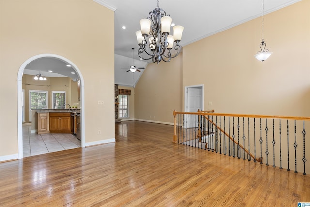 22582 Iron Masters Loop, Mccalla, AL 35111 - spare room with light wood-style floors, plenty of natural light, a ceiling fan, a chandelier, and ornamental molding