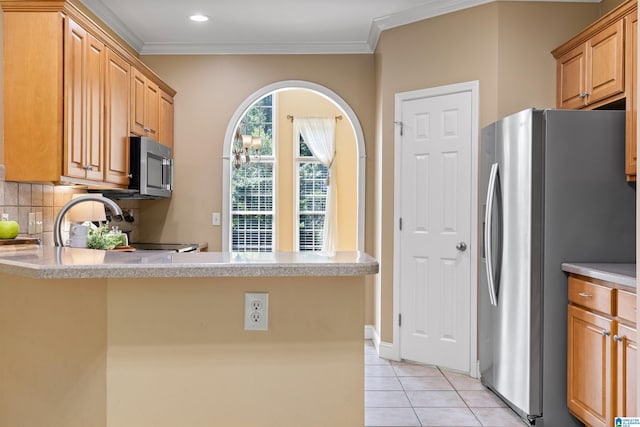 22582 Iron Masters Loop, Mccalla, AL 35111 - kitchen featuring stainless steel appliances, ornamental molding, a peninsula, light tile patterned floors, and light countertops