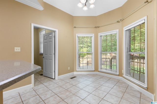 22582 Iron Masters Loop, Mccalla, AL 35111 - unfurnished dining area with light tile patterned floors, plenty of natural light, a chandelier, and baseboards