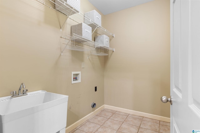 22582 Iron Masters Loop, Mccalla, AL 35111 - laundry area featuring hookup for a washing machine, baseboards, light tile patterned flooring, and hookup for an electric dryer