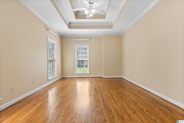 22582 Iron Masters Loop, Mccalla, AL 35111 - empty room with light wood-type flooring, a raised ceiling, a ceiling fan, crown molding, and baseboards