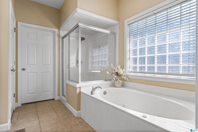 22582 Iron Masters Loop, Mccalla, AL 35111 - full bathroom featuring healthy amount of natural light, a shower stall, a tub with jets, and tile patterned flooring