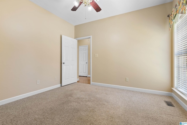 22582 Iron Masters Loop, Mccalla, AL 35111 - unfurnished room featuring a ceiling fan, carpet flooring, baseboards, and healthy amount of natural light