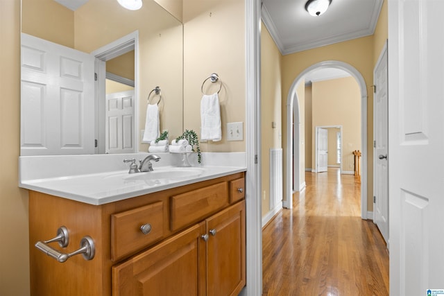 22582 Iron Masters Loop, Mccalla, AL 35111 - bathroom with crown molding, wood finished floors, vanity, and baseboards