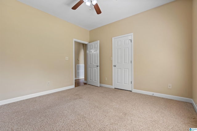 22582 Iron Masters Loop, Mccalla, AL 35111 - unfurnished bedroom with light carpet, baseboards, and ceiling fan
