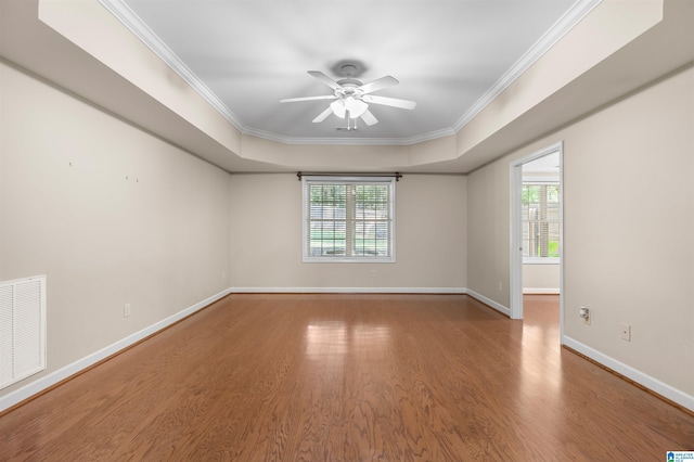 22582 Iron Masters Loop, Mccalla, AL 35111 - unfurnished room with ornamental molding, wood finished floors, baseboards, ceiling fan, and a raised ceiling