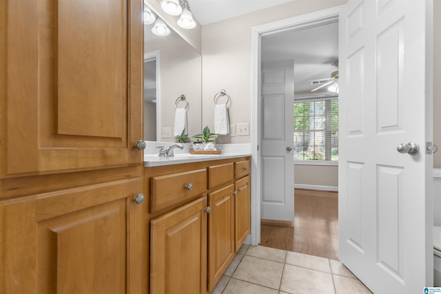 22582 Iron Masters Loop, Mccalla, AL 35111 - bathroom with tile patterned floors, vanity, toilet, and a ceiling fan