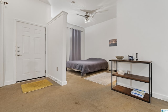 401 20th St S Unit 119, Birmingham, AL 35233 - bedroom with finished concrete flooring, baseboards, and a ceiling fan