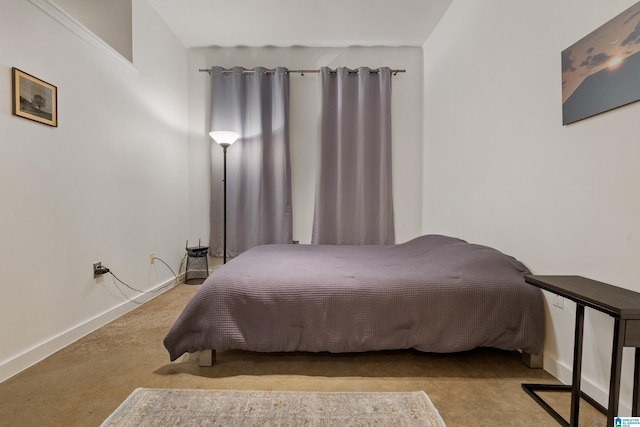 401 20th St S Unit 119, Birmingham, AL 35233 - bedroom with baseboards and carpet