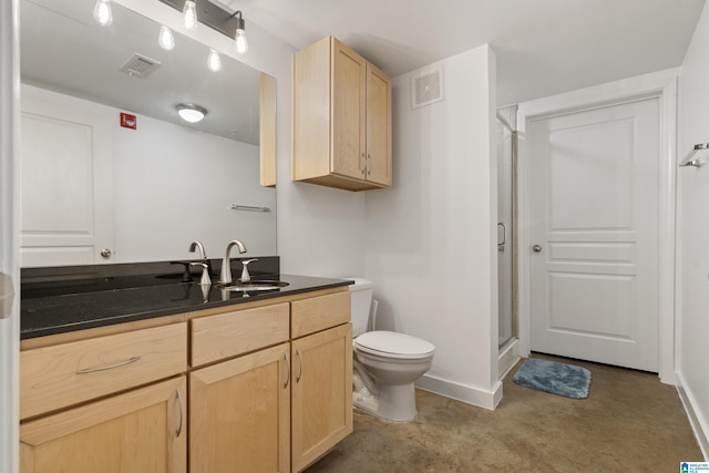 401 20th St S Unit 119, Birmingham, AL 35233 - bathroom featuring a shower stall, vanity, toilet, and baseboards