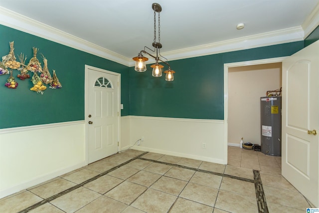1647 Moncrief Rd, Gardendale, AL 35071 - unfurnished dining area with electric water heater, ornamental molding, light tile patterned flooring, and baseboards