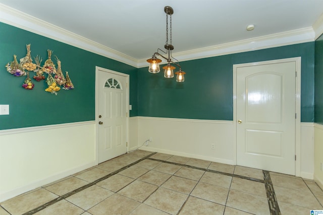 1647 Moncrief Rd, Gardendale, AL 35071 - unfurnished dining area with crown molding, light tile patterned floors, and inlaid floor details