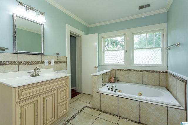 1647 Moncrief Rd, Gardendale, AL 35071 - bathroom with tile patterned floors, vanity, a tub with jets, and ornamental molding