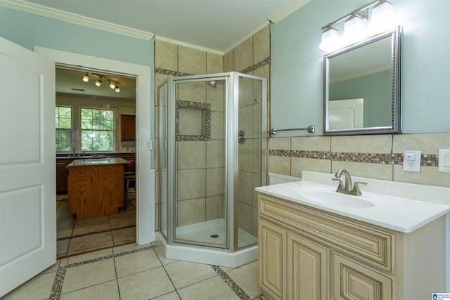 1647 Moncrief Rd, Gardendale, AL 35071 - full bath featuring ornamental molding, a stall shower, tile patterned flooring, vanity, and tile walls