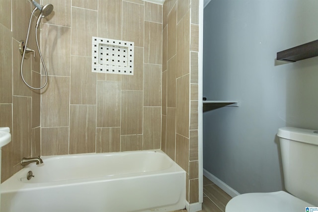 1647 Moncrief Rd, Gardendale, AL 35071 - bathroom featuring toilet,  shower combination, and baseboards