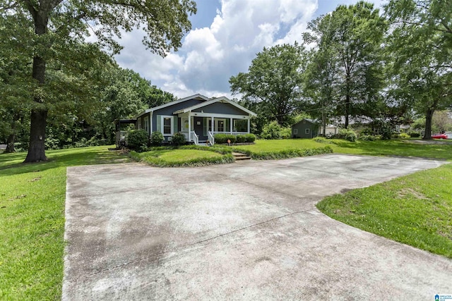 1647 Moncrief Rd, Gardendale, AL 35071 - view of front of home featuring a porch and a front lawn