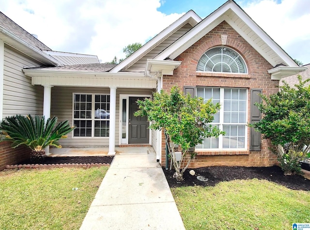 191 Sugar Hill Ln, Alabaster, AL 35007 - entrance to property featuring brick siding, a yard, and covered porch