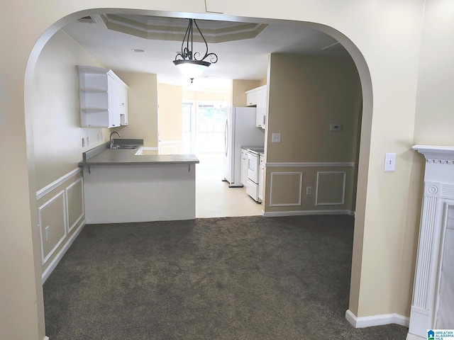 191 Sugar Hill Ln, Alabaster, AL 35007 - kitchen featuring a sink, arched walkways, white cabinetry, white appliances, and a decorative wall