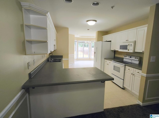 191 Sugar Hill Ln, Alabaster, AL 35007 - kitchen featuring white appliances, a sink, dark countertops, a peninsula, and open shelves